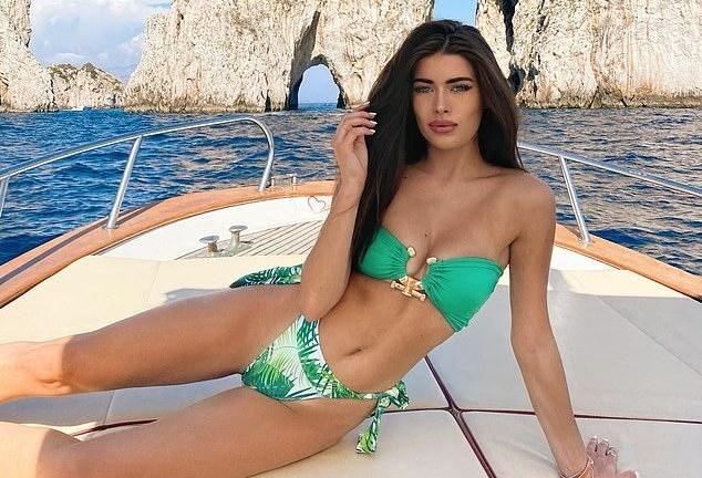 Ed Westwick’s model Girlfriend Tamara Francesconi looks fabulous in a green bikini as the couple sunbathes on the board of a yacht in Capri